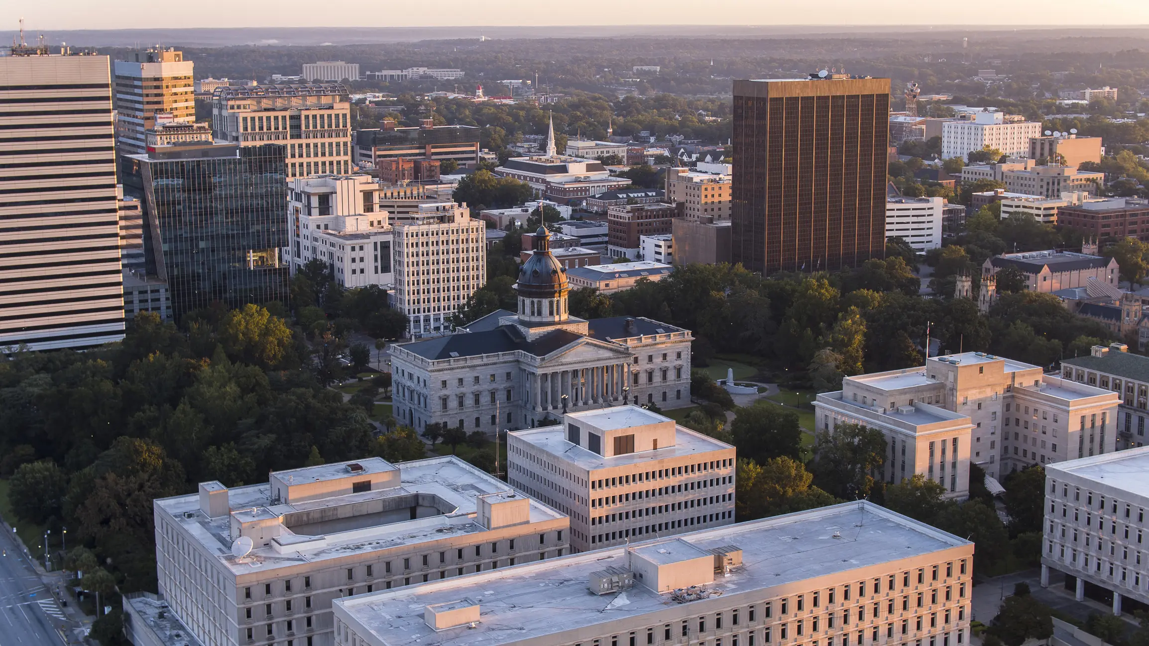 Aerial view of a cityscape at sunset.